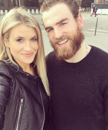 Dayna Douros with her husband Ryan O'Reilly looks gorgeous in a black dress.